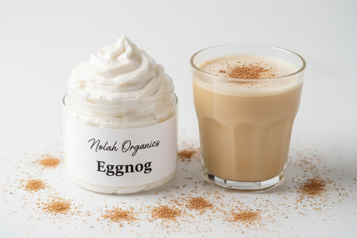 Make me a photorealistic photo of my Nolah Organics Eggnog white body butter. The body butter is in a clear jar and the butter is swirled high. The label is white with black writing. There is a glass of Eggnog nearby with nutmeg sprinkled on top and around the jar.